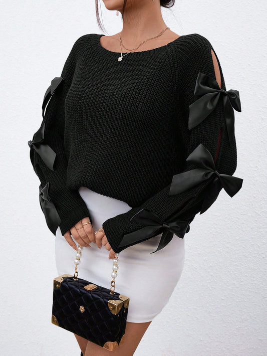 pull à manches raglan ajouré avec décoration nœud papillon.